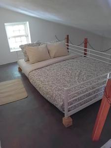 Postel nebo postele na pokoji v ubytování Retiro d'Azenha
