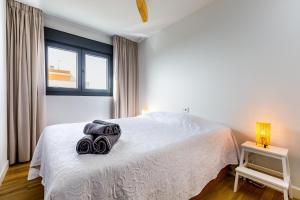 En eller flere senge i et værelse på A&N Atico Vista al Mar + 81 billeder