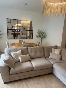 a living room with a couch and a table at Coastal Apartments No 1 in Seaham