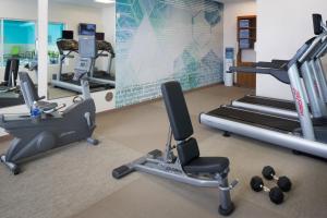 a gym with treadmills and elliptical machines at SpringHill Suites Anchorage University Lake in Anchorage