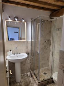 a bathroom with a sink and a shower at LA VILLA APARTMENTS - Convenient for Sardinia and Corsica - 5 beds -Private Parking included with Camera in Livorno