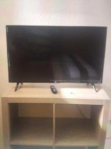 a flat screen tv sitting on top of a table at Lake house # 1 in Tacoma