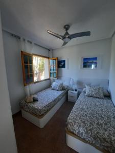 Ein Bett oder Betten in einem Zimmer der Unterkunft Vista Tabarca