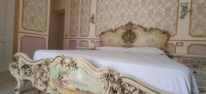 Letto o letti in una camera di B&B IL TEMPIO