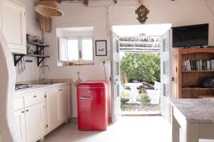 Kuchyň nebo kuchyňský kout v ubytování CASA MANORGAI UNO