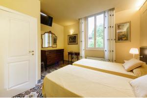 Letto o letti in una camera di B&B Casa Rossa