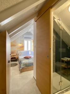 a bedroom with a bed and a sliding glass door at House Malena - Rooms in Vis
