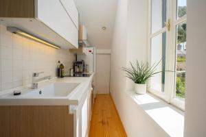 a kitchen with a sink and a window at Apartment St.Jacob in Dubrovnik