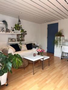 a living room with a couch and a table at Zuidwest Zeven free parking! in Zandvoort