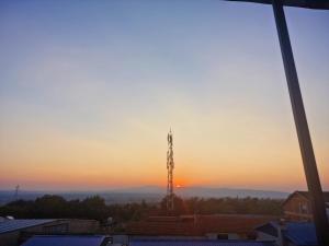 The sunrise or sunset as seen from a vendégházakat or nearby
