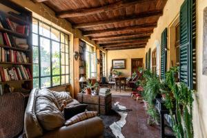 a living room with a couch and a table at Casa Scaparone in Alba