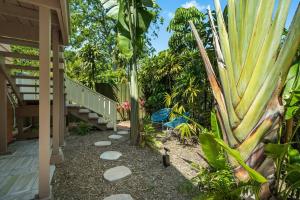 a garden with a walkway next to a house at Julia Place in Sarasota