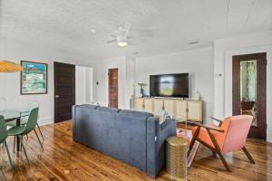 a living room with a blue couch and a table at Julia Place in Sarasota