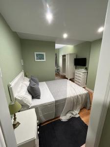 Postel nebo postele na pokoji v ubytování Green Suite