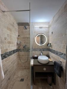 a bathroom with a sink and a shower at Cannes Villa Francia in Cannes +17 photos