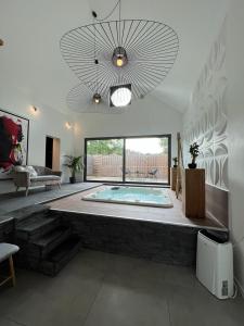 a large room with a large swimming pool in a house at Wellness Loft Huy in Huy