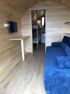 a living room with a couch and a table at Zatoka Marina IV in Mechelinki