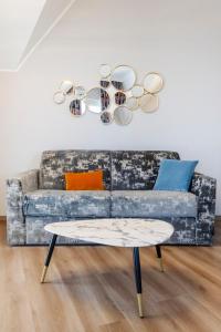 a living room with a couch and a table at Residence Carl&Do in Baveno