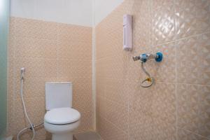 a bathroom with a toilet and a shower at Jo&Jo Hostel in Bandar Lampung