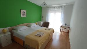 Postel nebo postele na pokoji v ubytování Apartment Marina