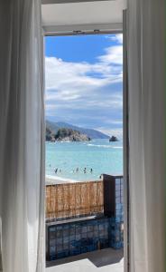 a view of the beach from a window at Benvenuto Beach House in Monterosso al Mare