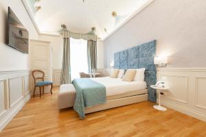 Posteľ alebo postele v izbe v ubytovaní Dei Priori Boutique Hotel