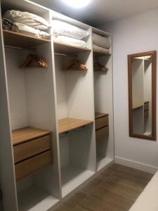 a walk in closet with shelves and a mirror at Serene House in Playa del Hombre in Playa del Hombre