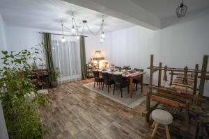 a dining room with a table and chairs at La 2 pruni 