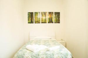 Ένα ή περισσότερα κρεβάτια σε δωμάτιο στο Guest House Garden dei Mille