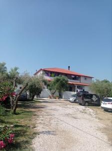 a building with cars parked in front of it at House Eugenia Sarti in Sarti