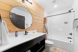 a bathroom with a sink and a mirror at Windswept Cove home in Hollister