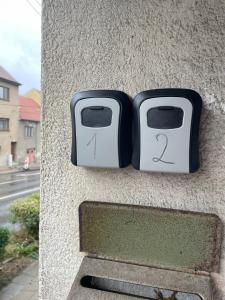a couple of toasters sitting on the side of a wall at Apartmán nad Bazilikou 2 in Třebíč +2 photos