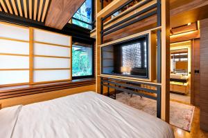 Ένα ή περισσότερα κρεβάτια σε δωμάτιο στο Hanami Design Hotel