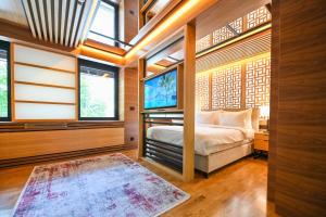 Ένα ή περισσότερα κρεβάτια σε δωμάτιο στο Hanami Design Hotel