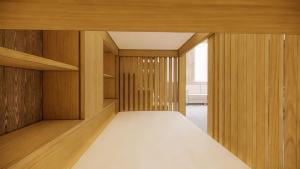 um quarto com armários de madeira e uma cama. em Gut Herzershof 