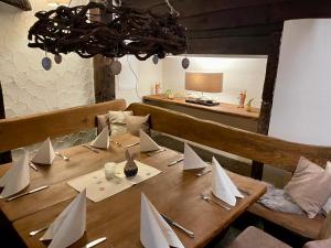a wooden table with paper boats on it at Haus Wiesengrund in Hürtgenwald