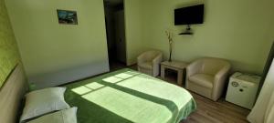 Łóżko lub łóżka w pokoju w obiekcie Complex Turistic Perla Trascaului