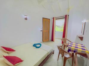 Una cama o camas en una habitación de Sayuru Villa