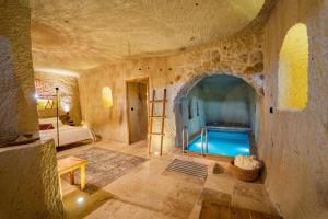 a room with a pool in the middle of a building at Vie Cappadocia - Adults Only in Nevşehir