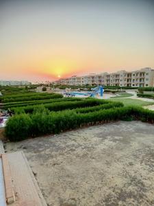 a view of the sunset from the balcony of a resort at Rivera Beach 1 - Ras Sedr in Ras Sedr