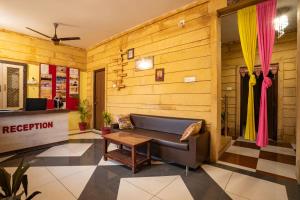 a living room with a couch and a table at Hotel Relax Inn Jaisalmer in Jaisalmer