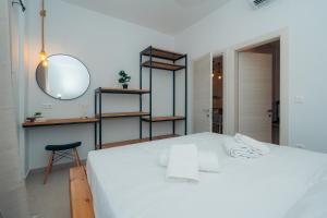 Postel nebo postele na pokoji v ubytování Loukoum House