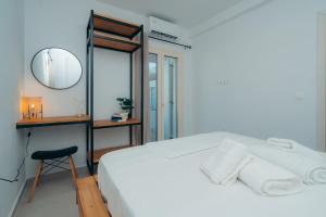 Postel nebo postele na pokoji v ubytování Loukoum House
