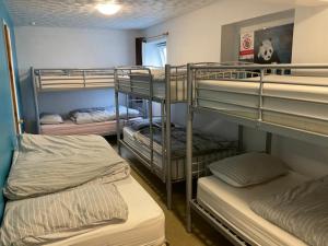 a group of bunk beds in a room at Blue Room Hostel Newquay in Newquay