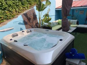 a bath tub sitting on top of a patio at Casa Vista Maroma in Málaga