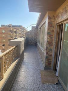 a balcony of a building with a view of a city at حدائق الاهرام in ‘Ezbet `Abd el-Ḥamîd