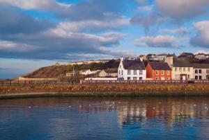 a town on the shore of a body of water at The Secret Nook in Maryport