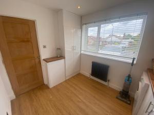 an empty room with a door and a window at Your Perfect Getaway with Hot Tub in Hale