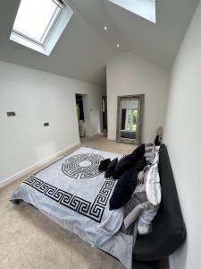 a bedroom with a large bed in a room at Your Perfect Getaway with Hot Tub in Hale