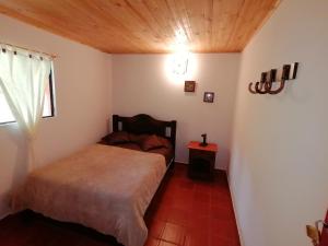 Postel nebo postele na pokoji v ubytování Nuestro Bosque I